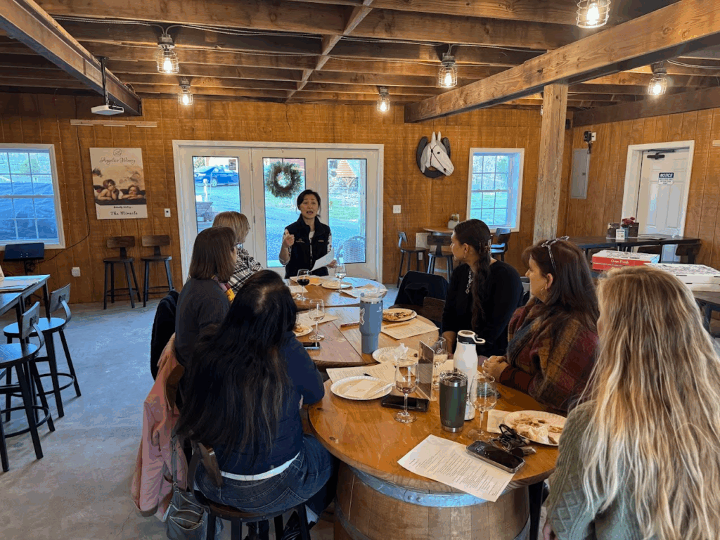 Group of friends enjoying a wine tasting at Angelico Winery