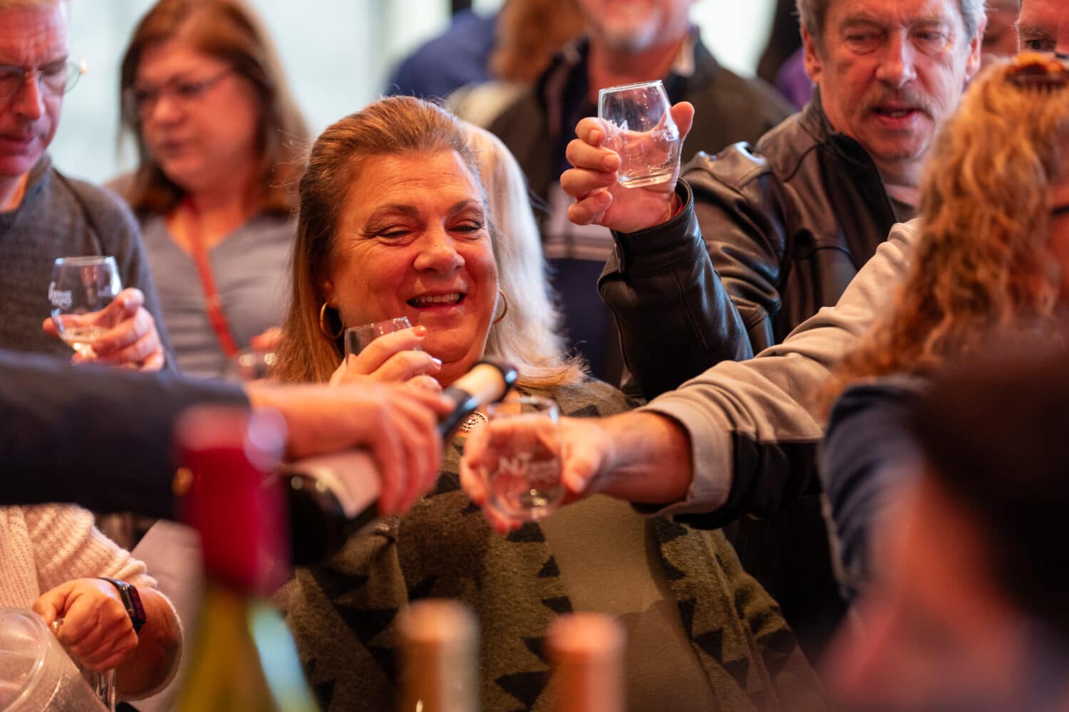 Guests raising tasting glasses at a previous NJ Wine Expo.